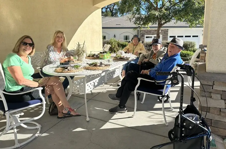 Debi Cassar sitting with some of the residents at Homelife Senior Living Debi Cassar sitting with some of the residents at Homelife Senior Living